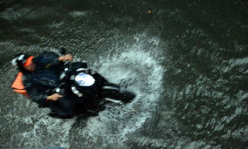 High angle view of man photographing sea