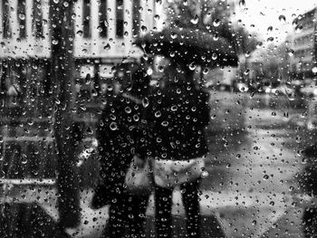 Full frame shot of wet glass window in rainy season