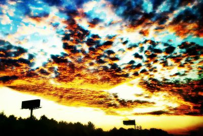 Silhouette of trees against sky at sunset