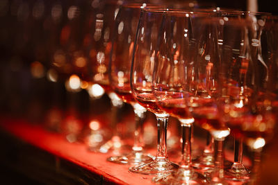 Close-up of wine glasses on table