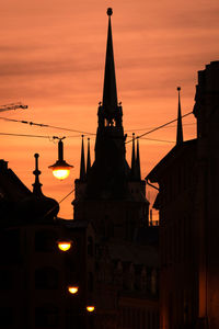 Low angle view of buildings against sky during sunset