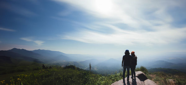 Rear view of man standing on mountain