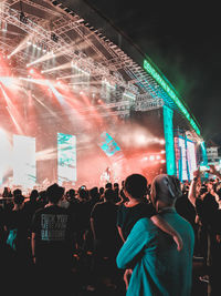 People enjoying music concert at night