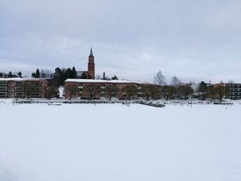 Buildings against sky during winter