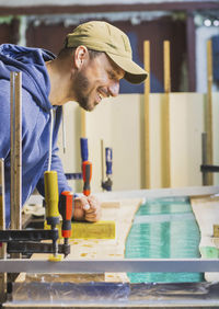 Side view of man working at gym