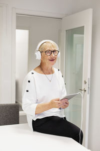 Senior woman listening music