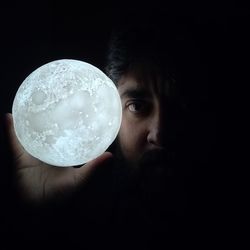 Man with a moon in his hands. conquer space