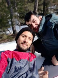 Portrait of young man and woman in winter