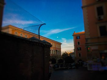 Low angle view of buildings against blue sky