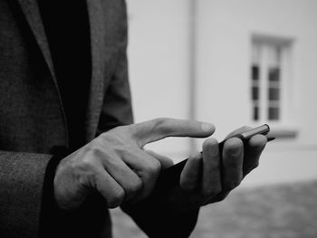 Close-up of hands text messaging