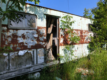 Abandoned trailer in forest