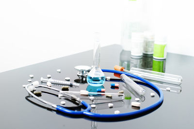 High angle view of motorcycle on table against white background