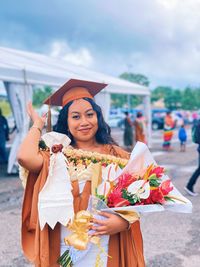 Portrait of woman wearing graduation gown