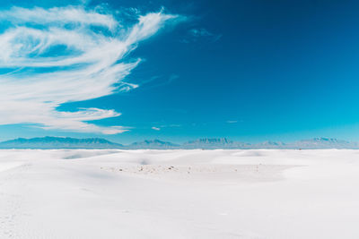 Scenic view of landscape against blue sky