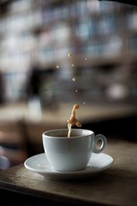 Close-up of coffee cup on table