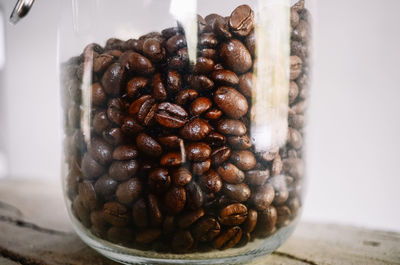 Close-up of coffee beans on table