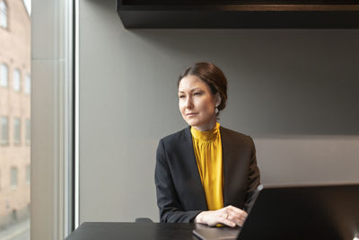 Thoughtful businesswoman in office