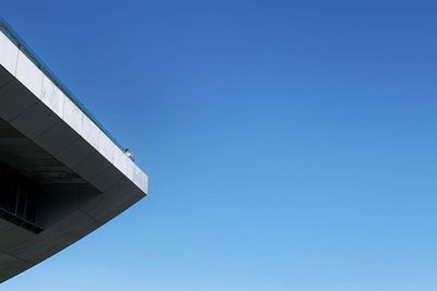 Low angle view of building against clear blue sky