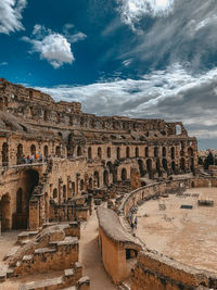 Old ruins of building against cloudy sky