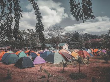 Tent on field against sky