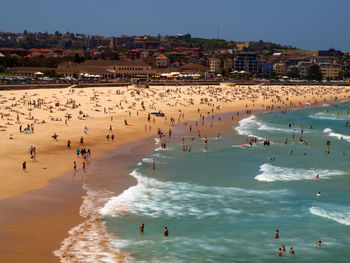 Aerial view of people enjoying at beach