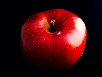Close-up of red object over black background