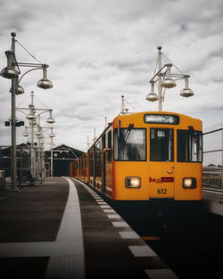 Train on railroad track against sky