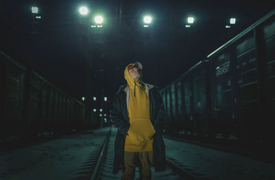 Woman standing on train at railroad station platform