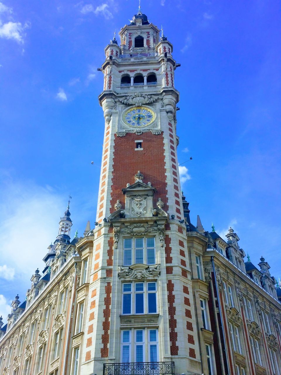 LOW ANGLE VIEW OF CLOCK TOWER IN CITY