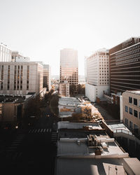 Buildings in city against clear sky