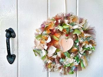 Close-up of wreath hanging on door
