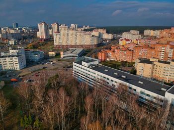 High angle view of buildings in city against sky