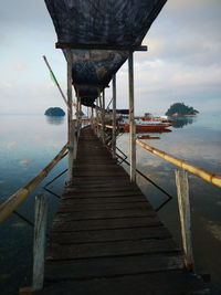 Pier over sea against sky