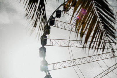 Low angle view of ferris wheel against sky