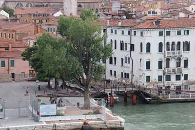 Canal amidst buildings in city