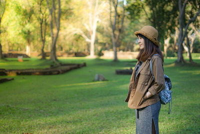 Side view of a young woman in park