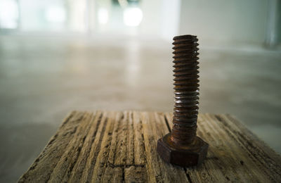 Close-up of rusty metal on table