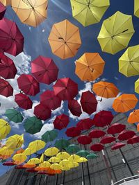 Low angle view of multi colored umbrellas