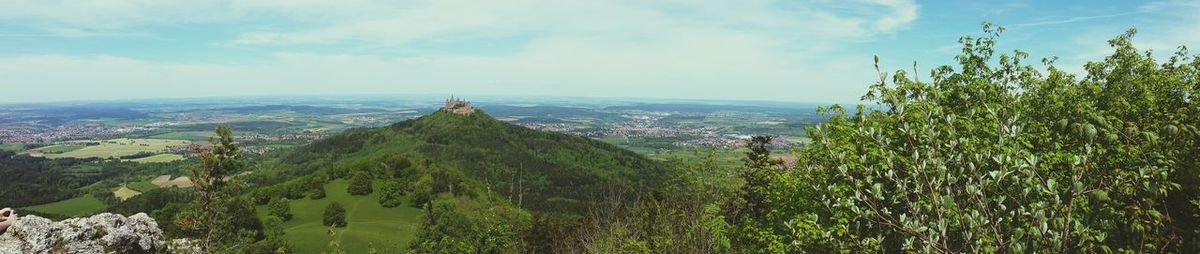 Scenic view of landscape against cloudy sky