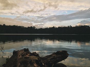 Scenic view of lake against cloudy sky