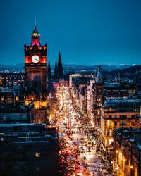 Illuminated buildings in city at night