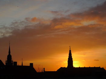 Silhouette of church against sky at dusk