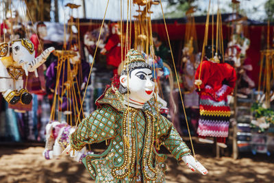 Puppets hanging for sale at market