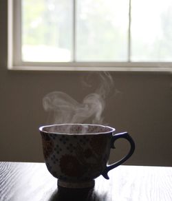 Close-up of coffee emitting smoke