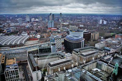 High angle view of modern buildings in city against sky