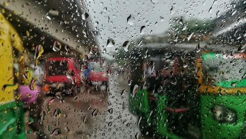 Raindrops on glass window during rainy season