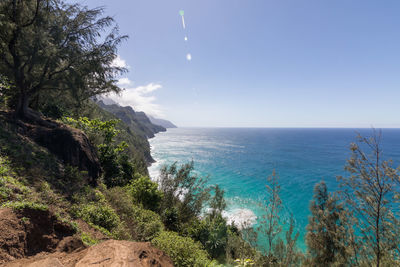 Scenic view of sea against clear blue sky of a coastline on kauai