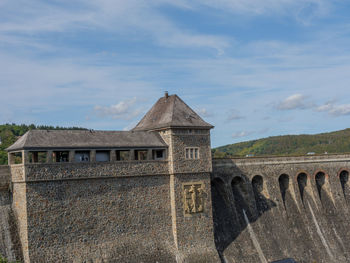 Old building against cloudy sky