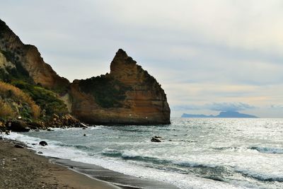 Scenic view of sea against cloudy sky