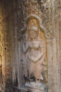 Statue on wall in temple